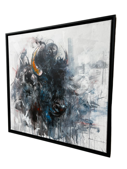 Abstract painting of a bull head in a black frame.