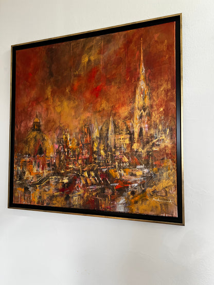 Abstract painting with warm tones on a white wall