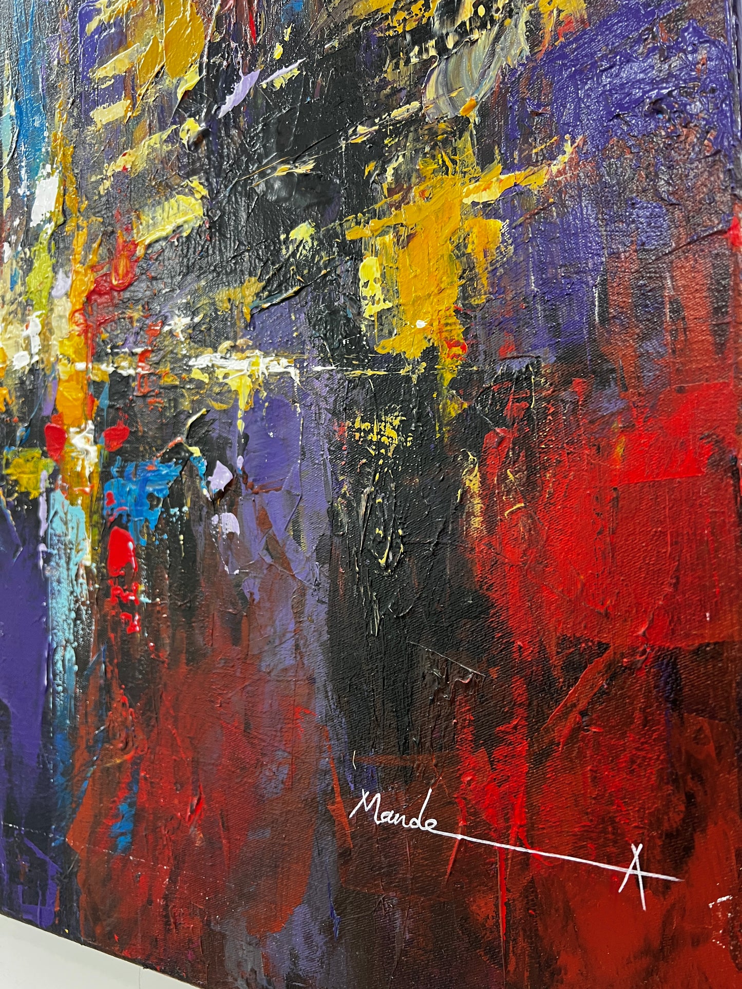 Abstract painting with bold colors and a signature on a white background