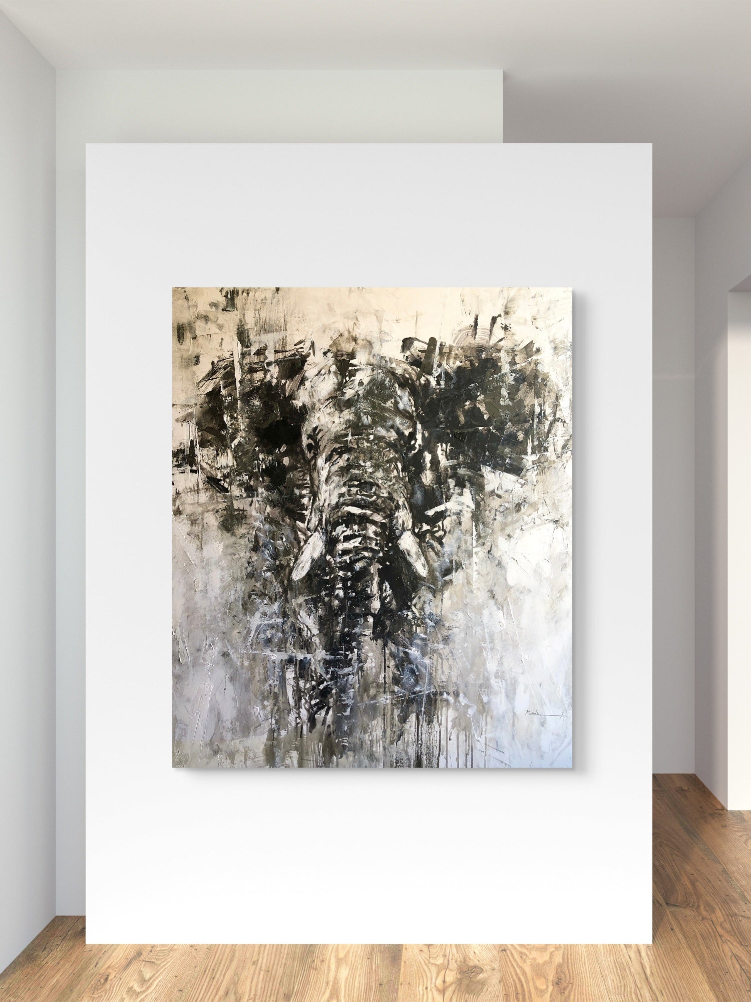 Abstract elephant painting on a white wall in a minimalistic room.
