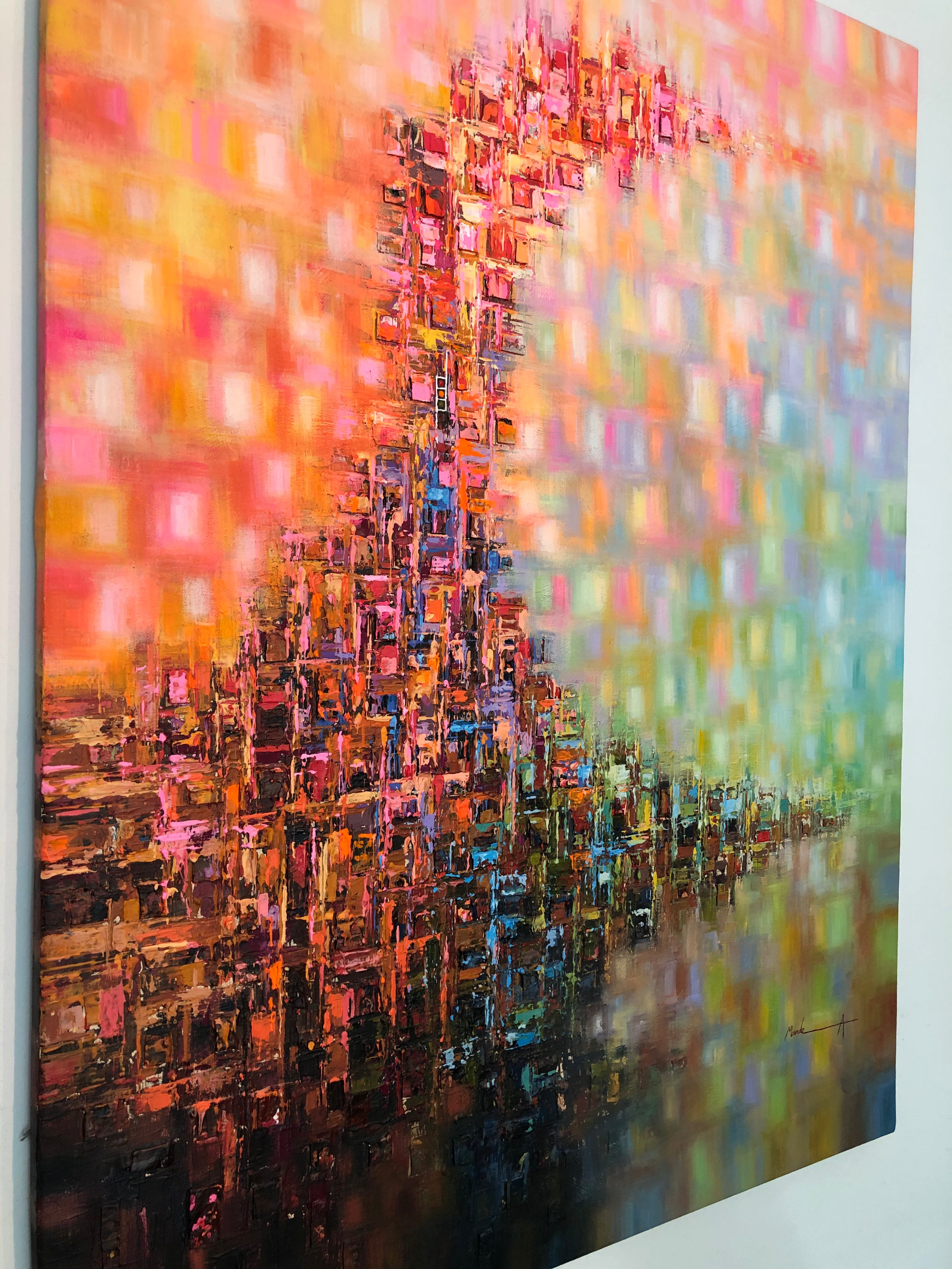 Abstract canvas wall art featuring a textured, blocky cityscape silhouette in warm orange, pink, and red tones blending into a green and blue gradient on the right, shown hanging on a white wall.